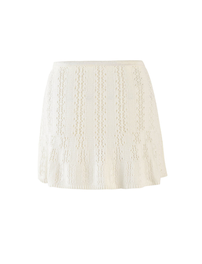 The SANDOR SKIRT - WHITE by TIGERMIST is a high-waisted, white knit mini skirt with a detailed vertical pattern. It features a slightly flared hem, providing a textured and stylish look.