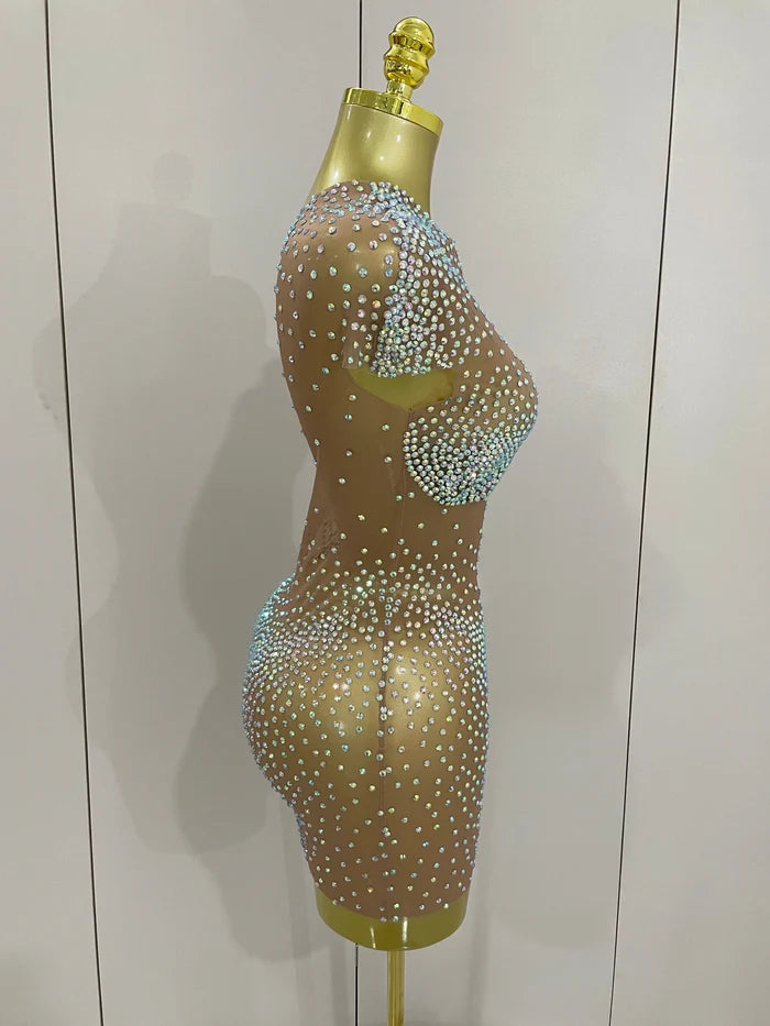 Sasha one shoulder rhinestone mesh sheer mini dress for women. Sexy party outfit for birthdays, nightlife, and stage wear.
