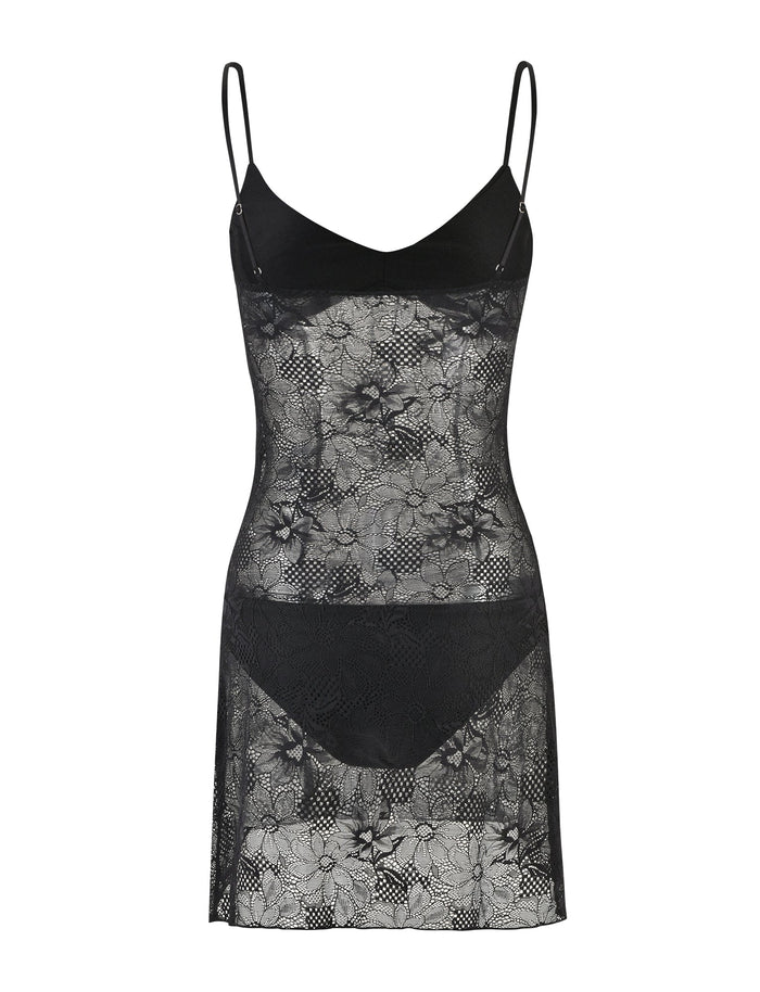 Introducing the SASKIA DRESS - BLACK from TIGERMIST, a stunning sheer lace slip dress featuring thin shoulder straps. This elegant piece showcases an intricate floral lace pattern and is designed with a partially opaque solid black upper bodice and matching panties.