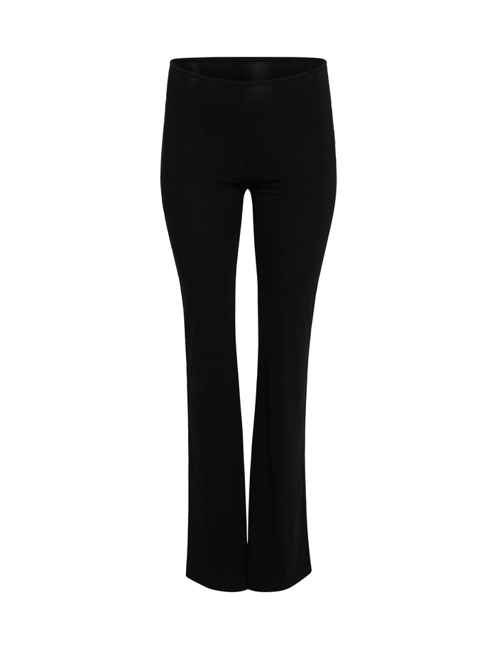 A front view of the SHAYNA PANT - BLACK from TIGERMIST. These full-length pants feature a fitted waist, a slim silhouette through the thighs, and a slight flare at the bottom. The material appears smooth and slightly shiny, indicating a likely stretchy or elastic fabric.