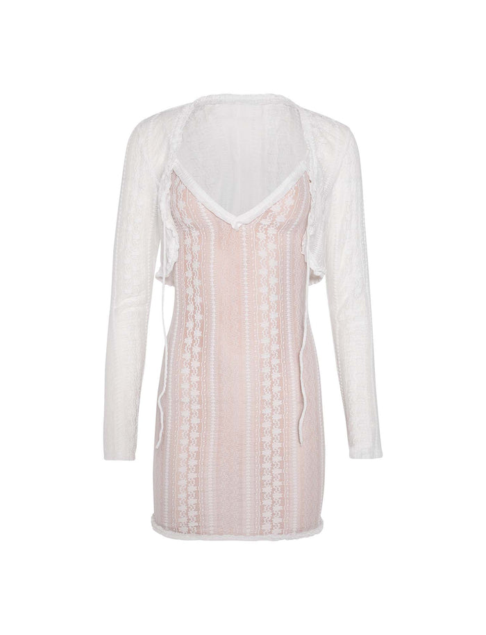 Here is a rewritten version using the provided product data:

The Sopha Two Piece Dress in white by TIGERMIST is a sheer, long-sleeved lace ensemble with a V-neckline. The dress showcases intricate patterns and includes a light pink slip underneath. Its delicate and elegant design makes it perfect for formal or evening occasions.
