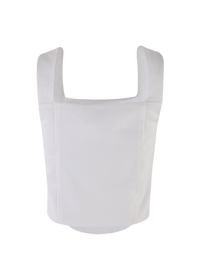 A front view of the white SULLIVAN TOP from TIGERMIST reveals a sleeveless crop top with wide shoulder straps. The ribbed fabric features a square neckline and offers a simple, minimalist design with clean lines and no visible embellishments.