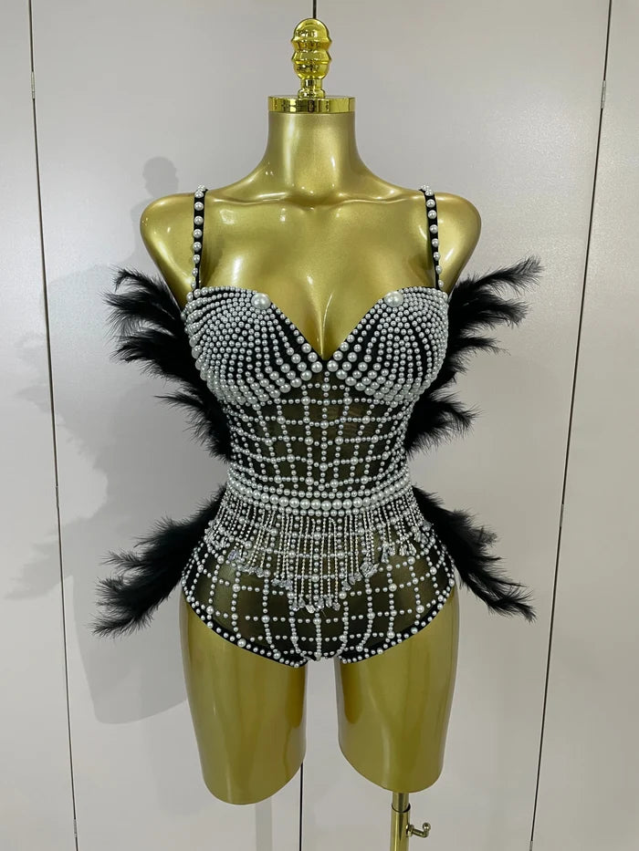 Shine in the Tabitha pearl, rhinestone, and feather mesh bodysuit. Luxury stretch outfit for stage performances, parties, and special events.