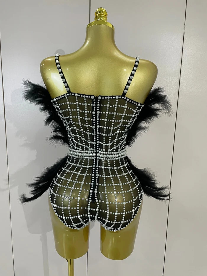 Shine in the Tabitha pearl, rhinestone, and feather mesh bodysuit. Luxury stretch outfit for stage performances, parties, and special events.