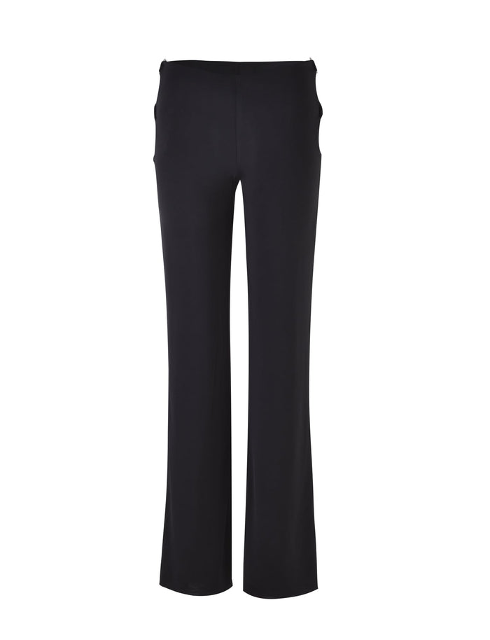 The TERI PANT - BLACK from TIGERMIST is showcased against a plain white backdrop. These black, high-waisted, wide-leg pants are made from smooth, slightly stretchy fabric. The minimalist design includes two side pockets and features no visible fasteners.