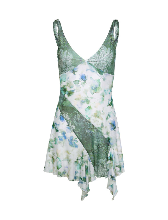 Introducing the TIGERMIST THEO DRESS – a floral masterpiece in green, blue, and white featuring a sleeveless design with a V-neckline. This elegant dress showcases an asymmetrical hemline and an open back for a light and airy look.
