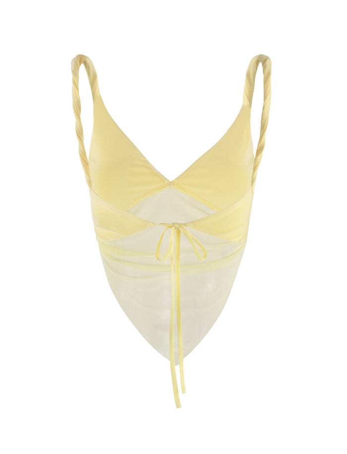 Introducing the THEO TOP - YELLOW : LEMON from TIGERMIST, a pastel yellow twisted strap bralette designed for a feminine and chic look. This stylish top features a sheer mesh insert, adjustable front tie closure, and V-neckline that adds a touch of allure to its overall design.