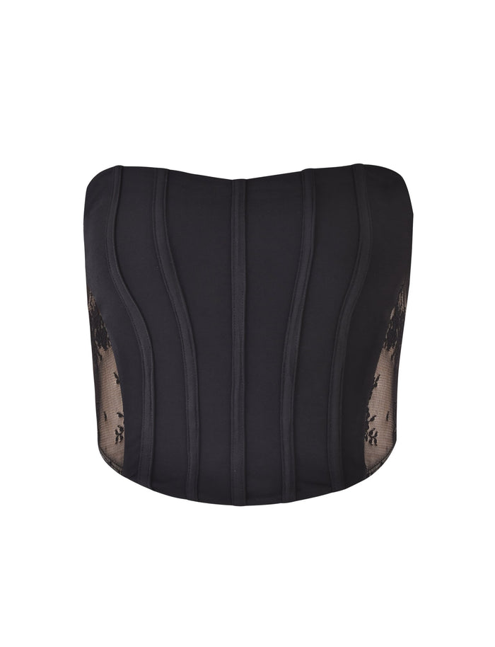 The TIANNA TOP - BLACK by TIGERMIST is a strapless corset featuring boning detail for structure. The sides are adorned with sheer lace panels showcasing floral motifs, adding a touch of elegance and allure to the design.