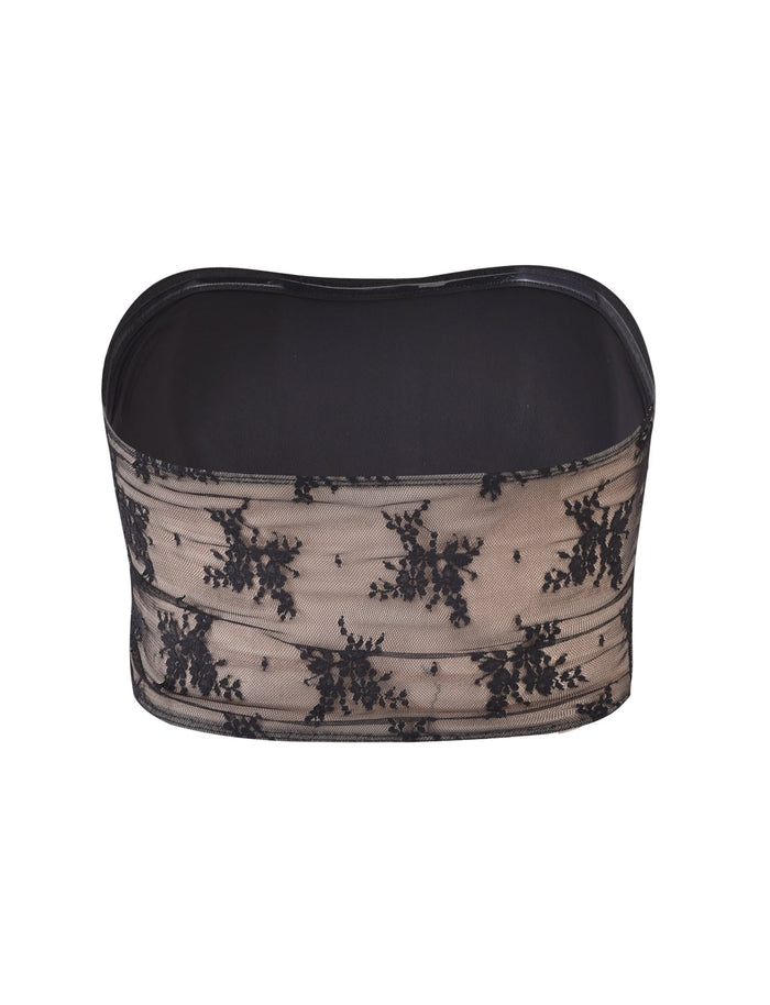 The TIANNA TOP - BLACK from TIGERMIST is a beige and black lace bandeau featuring an intricate floral design. This elegant and daring strapless top boasts a see-through lace overlay with delicate black floral patterns and a solid black lining for coverage.