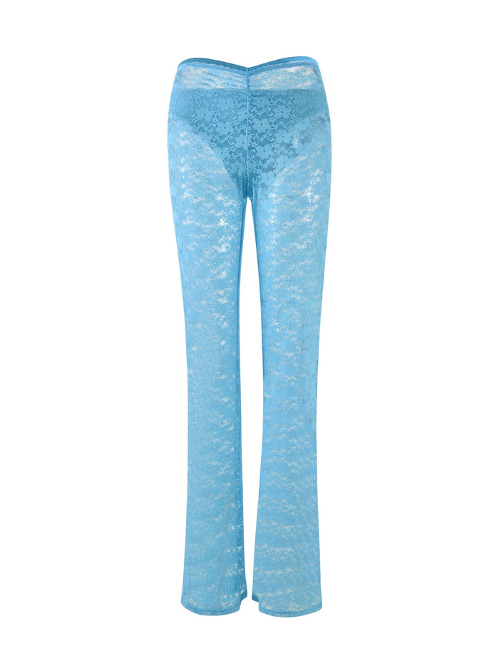 The TOBIAS PANT in Ice Blue from TIGERMIST is showcased against a white background. Its high-waist and subtly flared leg design create a flattering silhouette, while the intricate bright blue lace pattern offers a delicate, stylish touch to the garment.