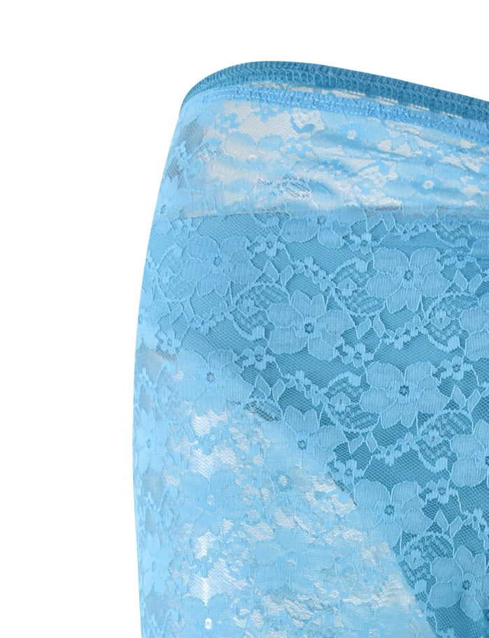A close-up of TIGERMIST's TOBIAS PANT in bright blue lace reveals its intricate floral pattern. The semi-transparent, delicate fabric beautifully showcases the fine details in its design.