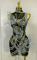 Toni sparkly silver diamond butterfly mesh mini dress for women. Sexy sheer party outfit for birthdays, nightlife, and stage wear.