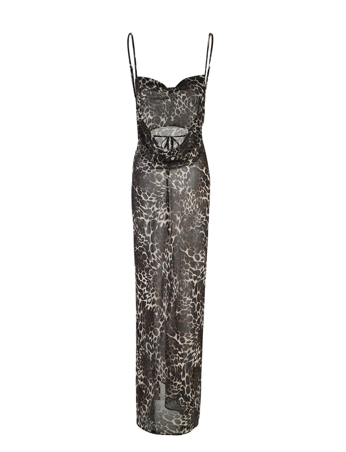 The TYNE DRESS - MULTI : LEOPARD by TIGERMIST is a sheer black dress that showcases a Leopard Print design. It features thin shoulder straps, a sweetheart neckline, and a cut-out detail at the waist. The dress also has a long, flowing skirt that extends to the floor.