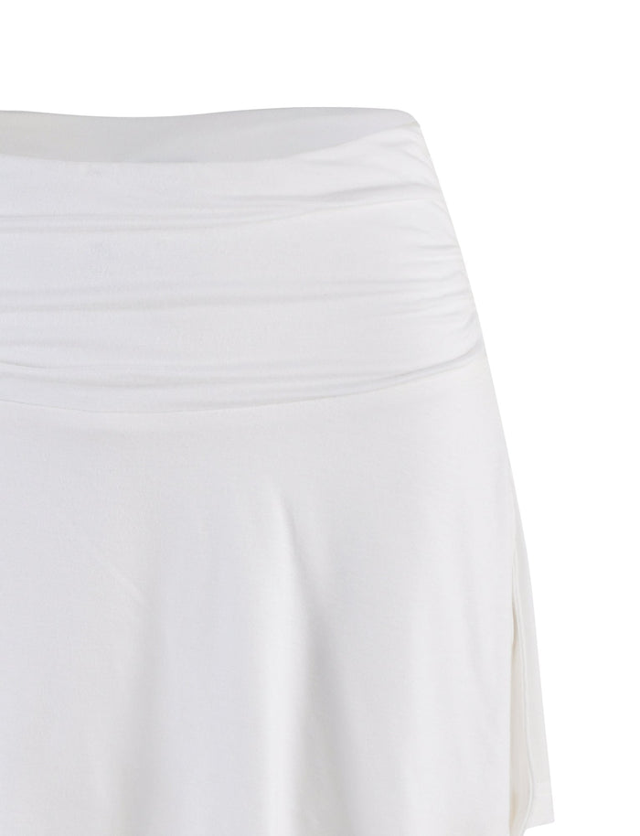 A close-up of the upper section of the TIGERMIST VERITY SKORT in white, featuring a ruched waistband and soft, lightweight fabric, displayed against a plain white background.