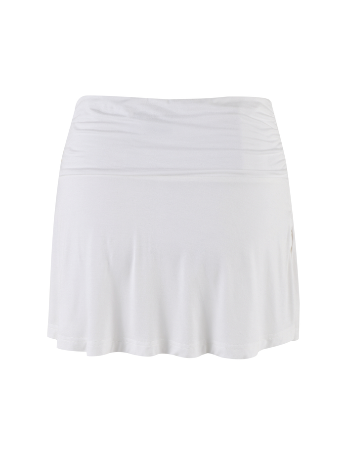 The VERITY SKORT by TIGERMIST is a white, knee-length flared skort featuring a wide waistband and soft jersey fabric, shown against a plain white background.