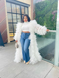 White ruffle tulle duster coat layered over jeans and crop top, statement luxury outfit for women