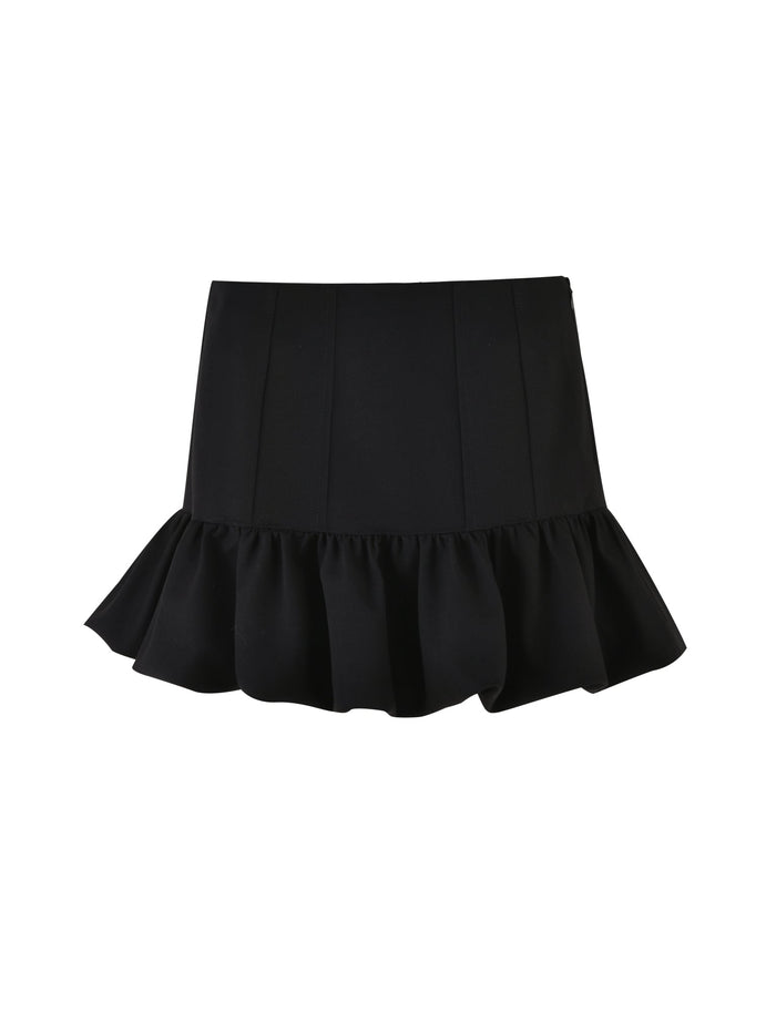 The XANDRA SKIRT - BLACK by TIGERMIST features a high waist and a ruffled hem. Its simple yet elegant design is crafted from smooth fabric, with a subtle flare at the bottom. The addition of ruffles provides a feminine touch, making the skirt both playful and stylish.