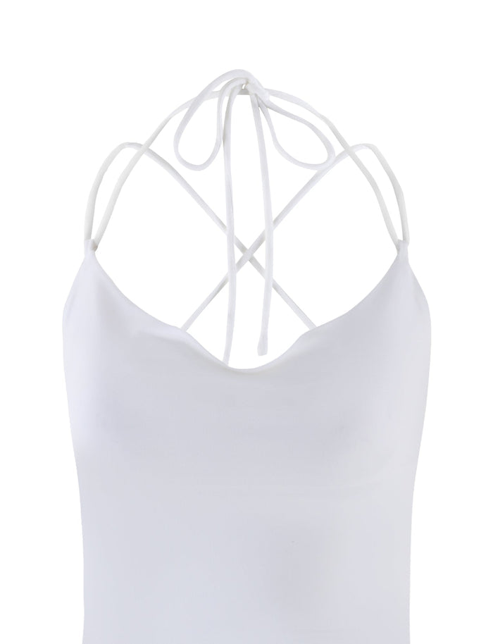 The ZAIDA TOP - WHITE from TIGERMIST features thin, crisscrossing straps and a low-cut back. The smooth, fitted fabric gives the top a minimalist and elegant look.